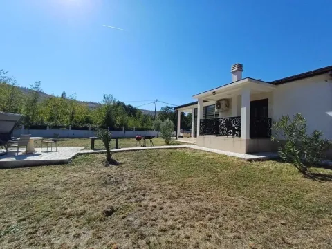 Exterior of the house with a landscaped yard and terrace. - image 2