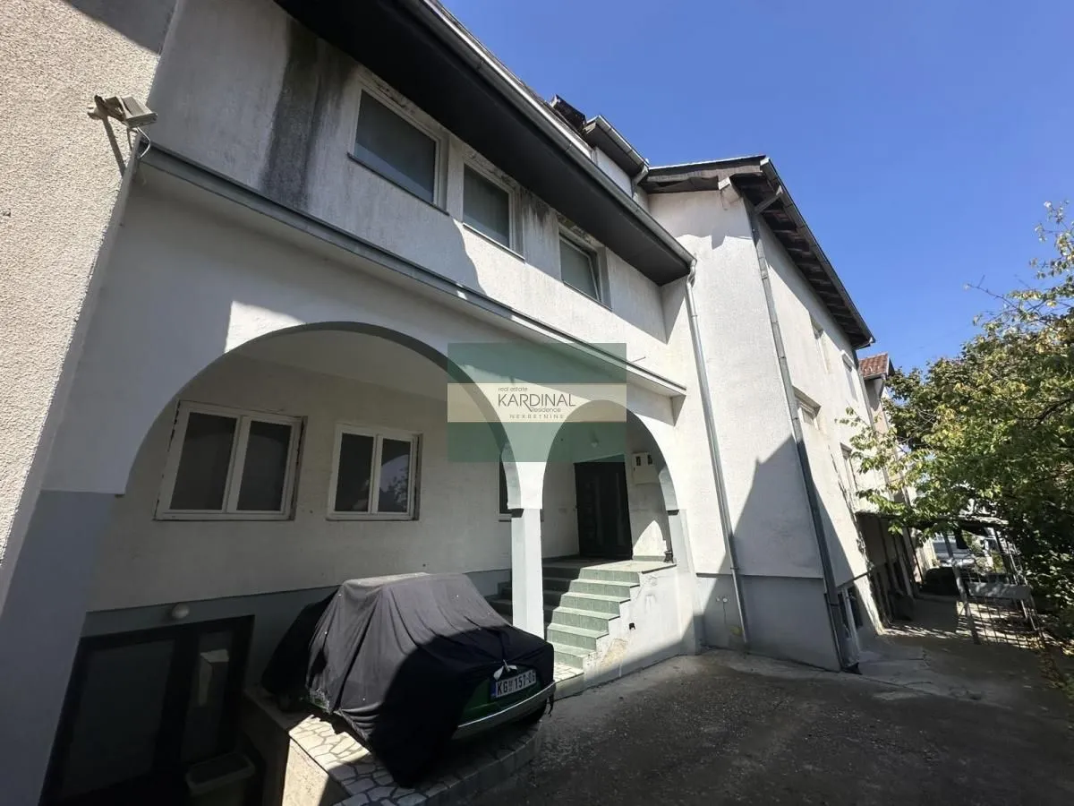View of the exterior of the house with an entrance and covered parking.