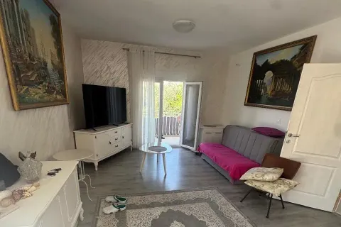 Living room with sofa, TV, and access to the terrace. - image 3