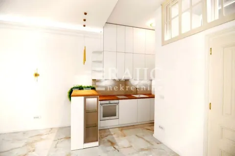 Modern white kitchen with wooden worktop elements. - image 6