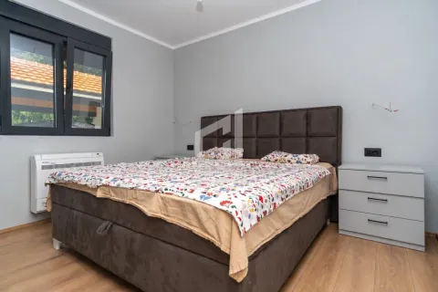 Bedroom with a double bed and bedside tables. - image 5