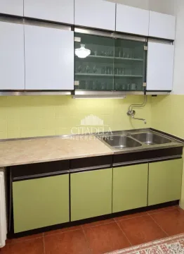 Small kitchen with a countertop and sink. - image 8