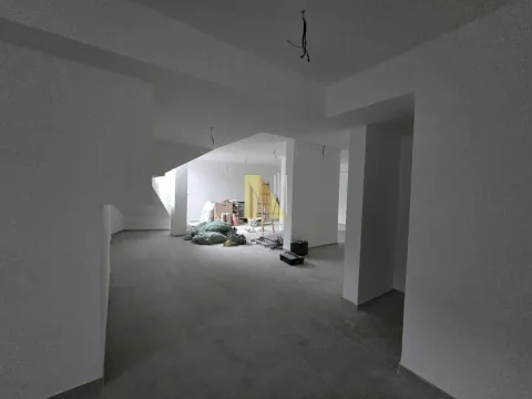 Empty space under construction with white walls and building material. - image 12