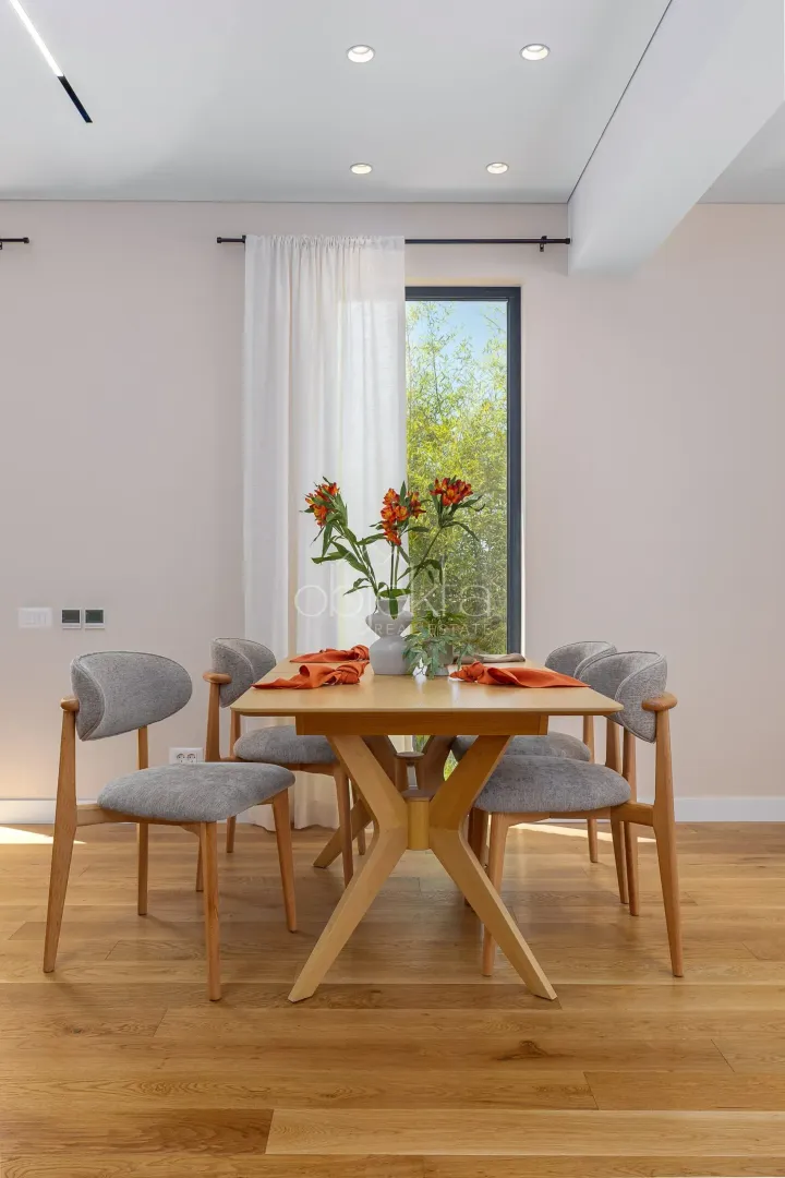 Dining table with chairs in a modern interior.