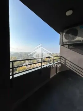 Covered balcony with metal railing and view of the surroundings. - image 13