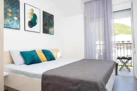Bedroom with a double bed and access to the terrace. - image 12