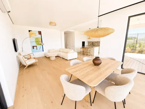 Spacious living room with a dining area and an open view towards the kitchen. - image 5