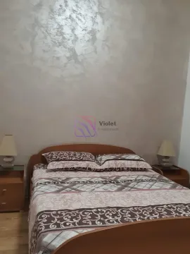 Furnished bedroom with a double bed and nightstands. - image 5