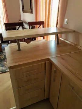 Wooden kitchen unit with a breakfast bar and drawers. - image 6