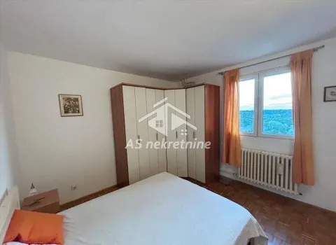 Furnished bedroom with a double bed, wardrobe, and a window. - image 8