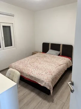 Bedroom with a double bed and a desk. - image 5