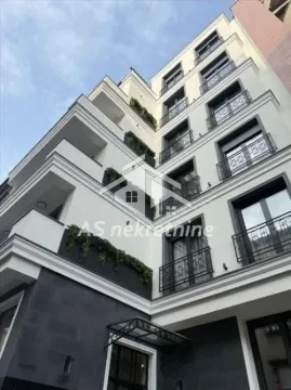 View of the facade and entrance of an apartment building with balconies. - image 15