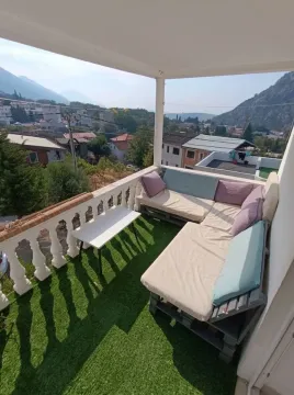 Covered terrace with seating furniture and a view of the surroundings. - image 3