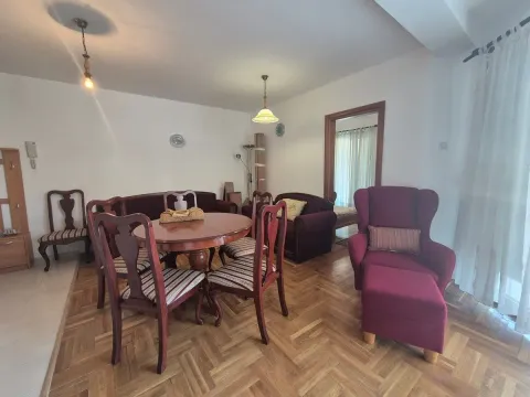 Living room with a dining table and seating furniture. - image 2