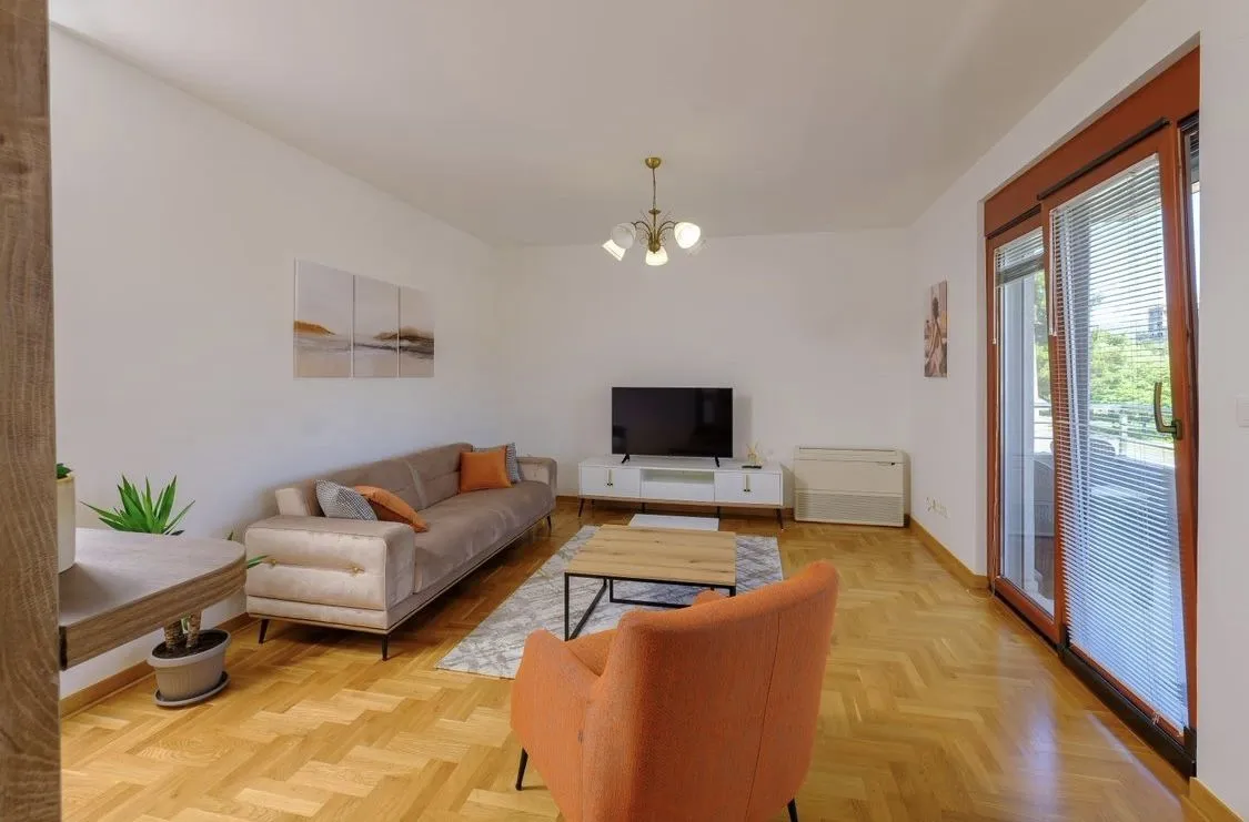 Bright and tidy living room with modern furniture.