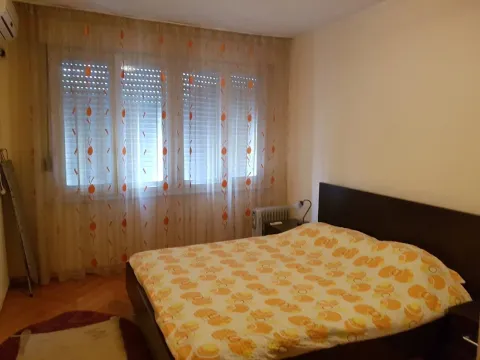 Simple bedroom with a double bed. - image 6