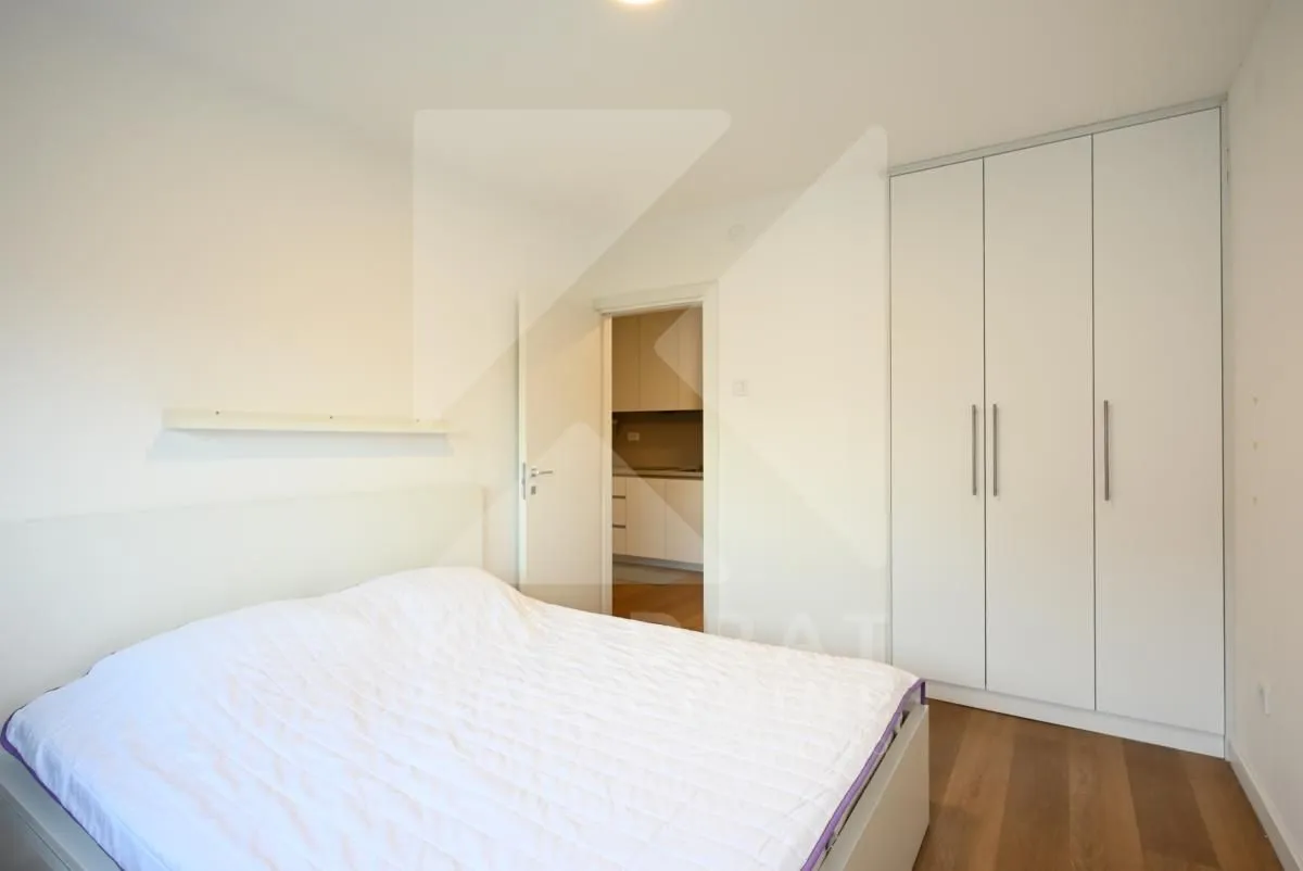 Bedroom with a double bed and a fitted wardrobe.