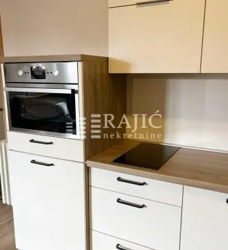 Modern kitchen with built-in elements and appliances. - image 5