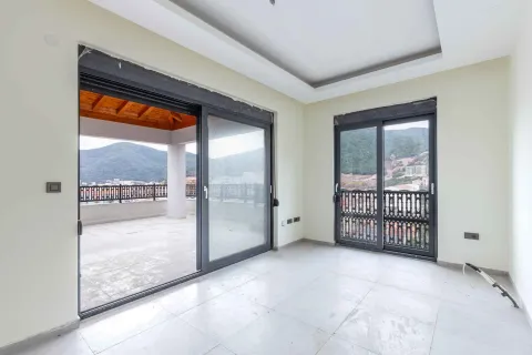 Empty room with access to a spacious terrace and mountain views. - image 8
