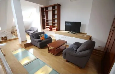 Living room with seating set, TV, and wooden shelving. - image 26