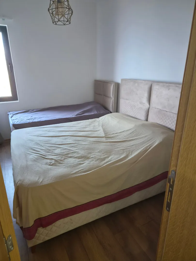 Bedroom with a double bed and an additional single bed.