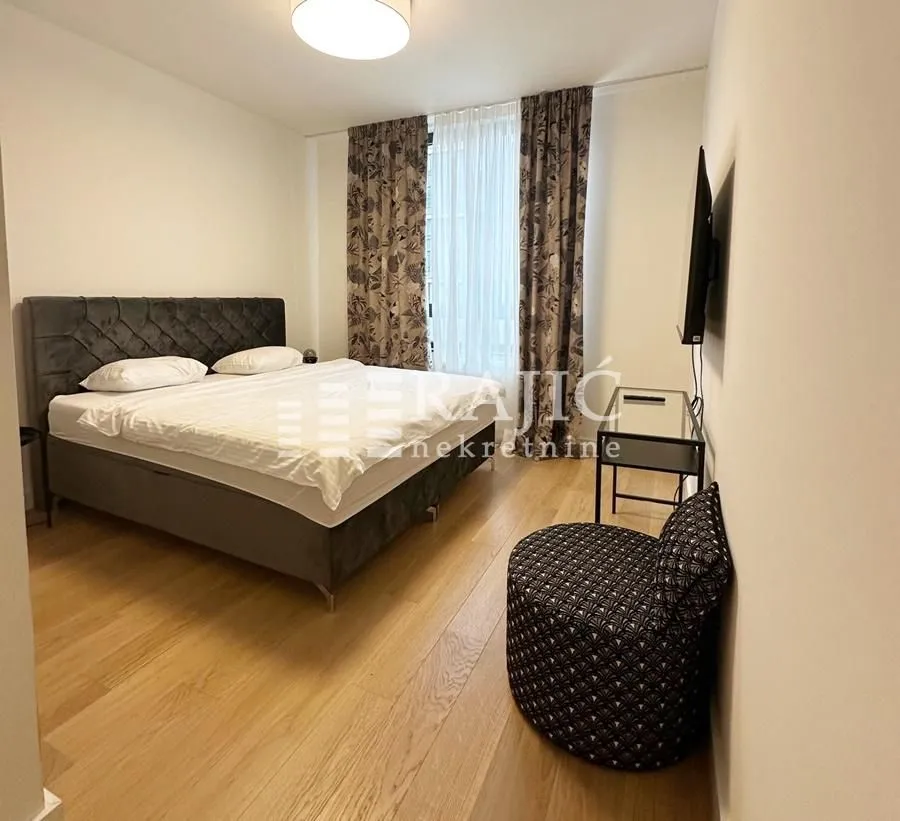 Furnished bedroom with a double bed.