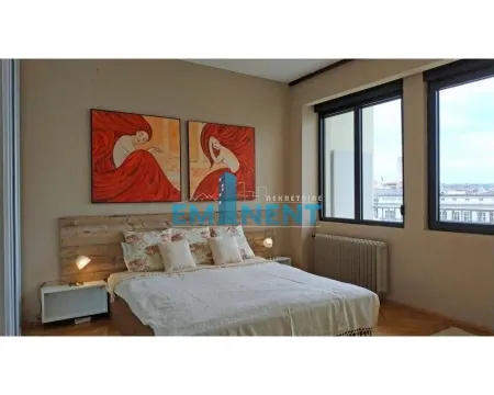 Furnished bedroom with a double bed, wall art paintings, and windows with a view. - image 8