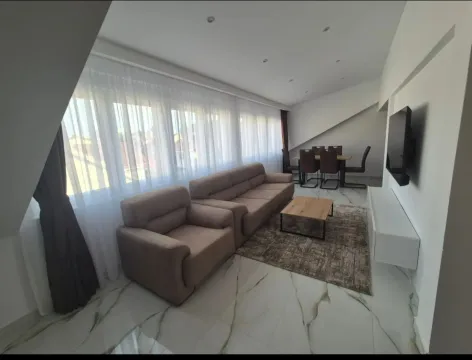Spacious living room with a seating set and a dining area. - image 8