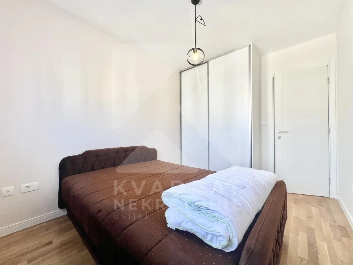 Bedroom with a double bed and a fitted wardrobe.