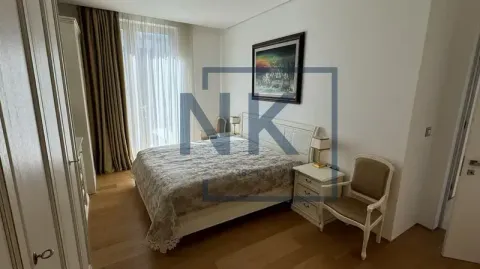 Spacious bedroom with a double bed, wardrobe, and terrace access. - image 8
