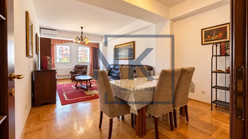 Living room with a dining area and seating furniture.