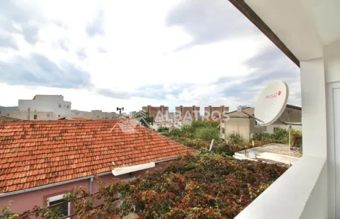 View from the terrace towards the surrounding buildings and neighborhood. - image 9