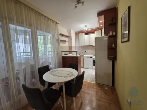 Kitchen with a dining table and access to the terrace. - image 14