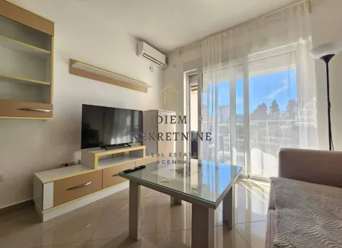 Furnished living room with TV unit and sofa. - image 15