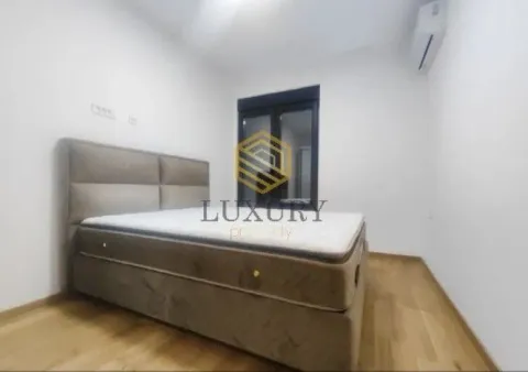 Empty bedroom with a double bed and air conditioning. - image 3