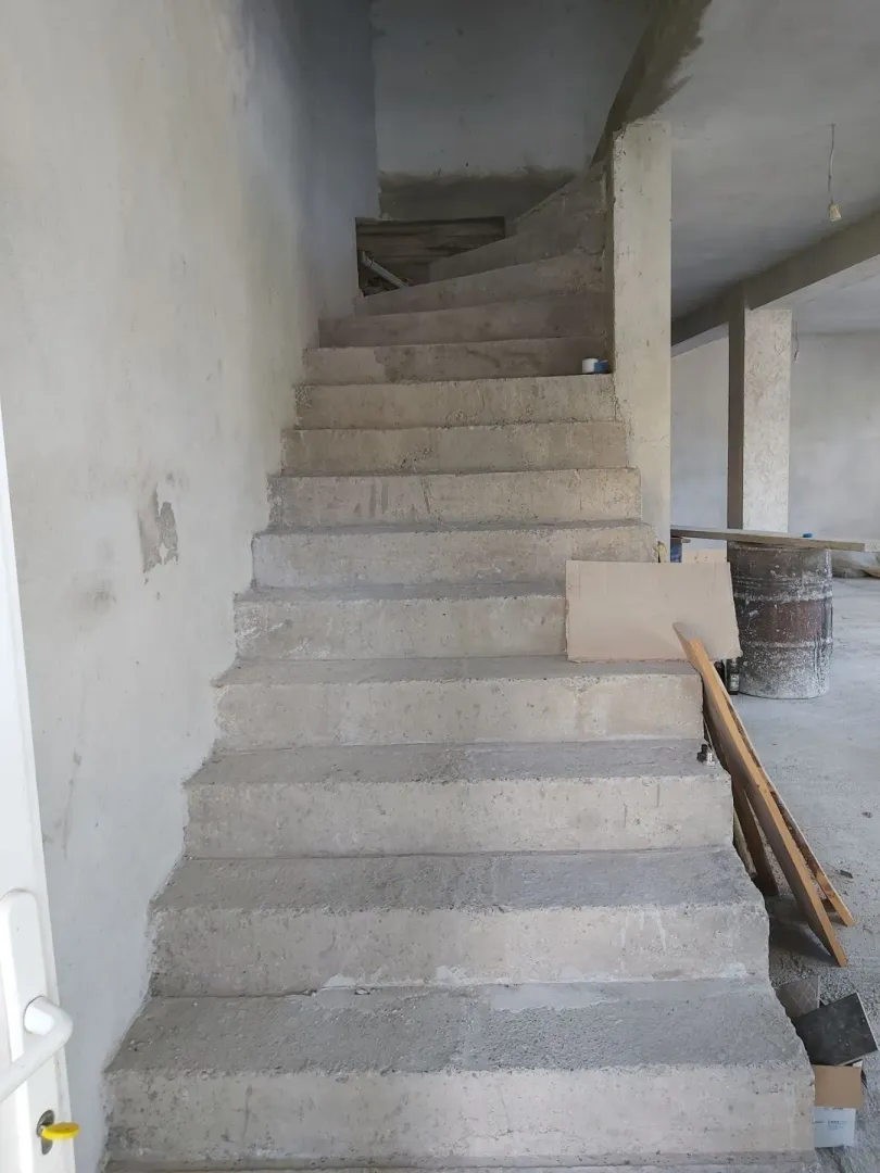 Concrete staircase in a building under construction.