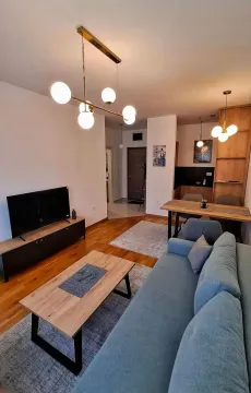 Modern and bright living room with a dining area. - image 2