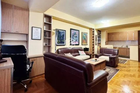 Spacious living room with sofa set, desk and open access to the kitchen. - image 3