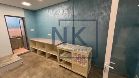 Empty kitchen with work units and blue walls. - image 6
