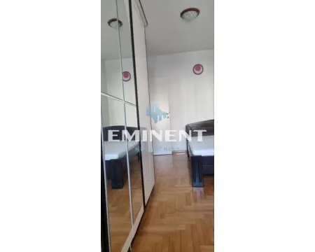 Bedroom with a bed and a large mirrored wardrobe. - image 7