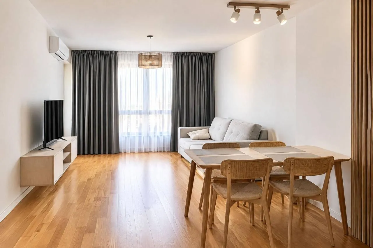 Living room with dining area and sofa.