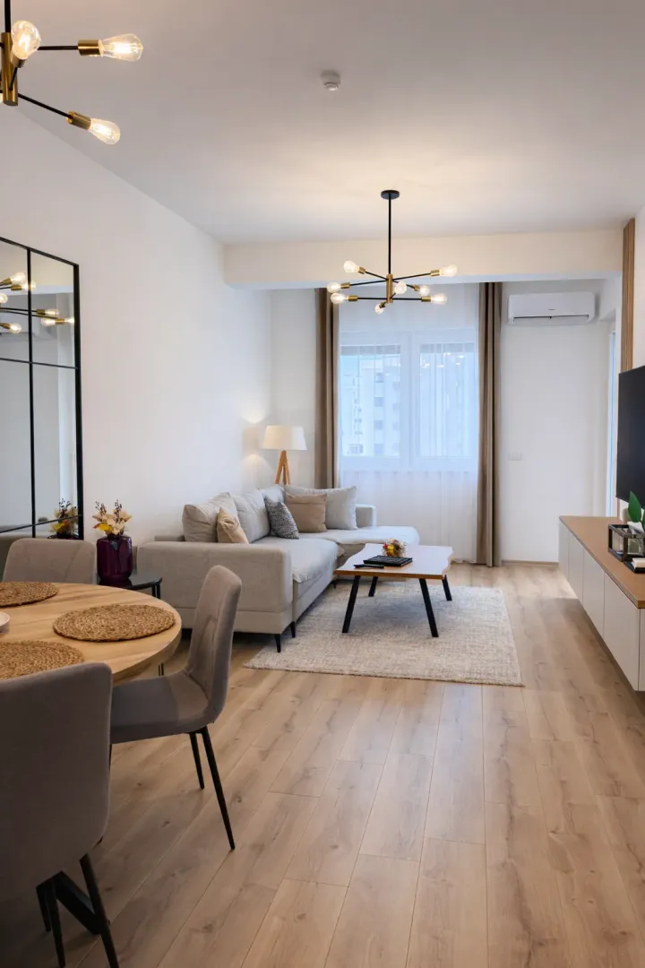 Modern and bright living room with a dining area.