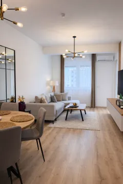 Modern and bright living room with a dining area. - image 13