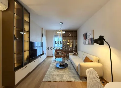 Modern and tidy living room with sofa, TV unit, and shelving. - image 13