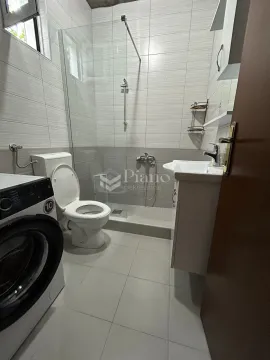 Smaller bathroom with a shower cabin, washbasin and washing machine. - image 6