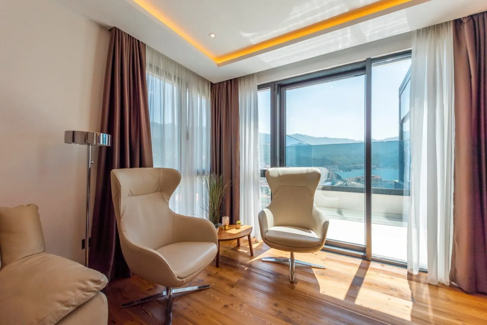Bright seating area with two armchairs and a nice view.