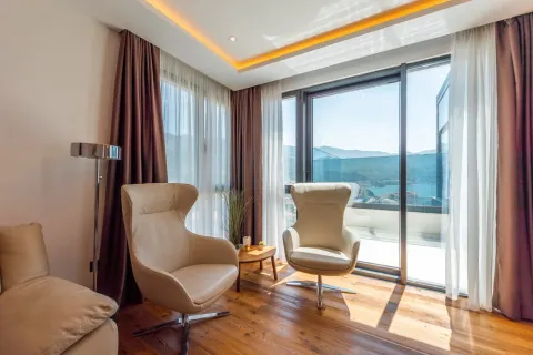 Bright seating area with two armchairs and a nice view. - image 13