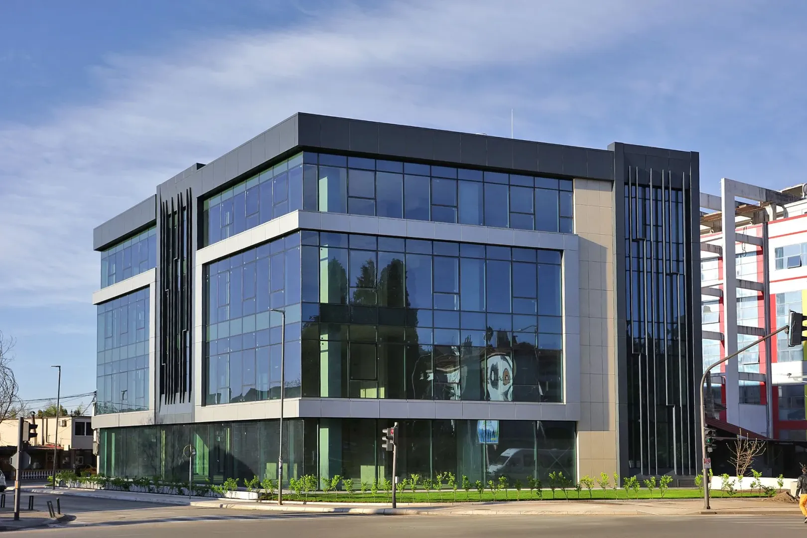 View of a modern commercial building with a glass facade.