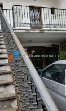 Exterior view of the stairs and building entrance. - image 2
