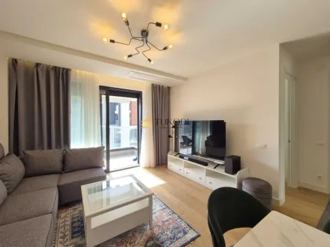 Living room with sofa, TV unit, and access to the terrace. - image 4
